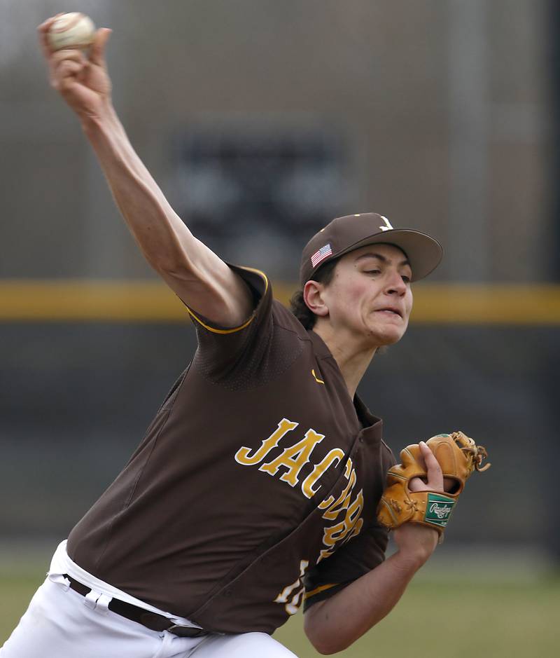 Jacobs’s Brandon Helbig throws a pitch during a Fox Valley Conference baseball game Friday, April 15, 2022, between Jacobs and McHenry at Petersen Park in McHenry.