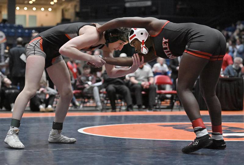 Kaneland’s Angelina Gochis and Huntley’s Janiah Slaughter compete in the 105-pound bout at the girls wrestling state finals at Grossinger Motor Arena in Bloomington on Saturday, Feb. 24, 2024.