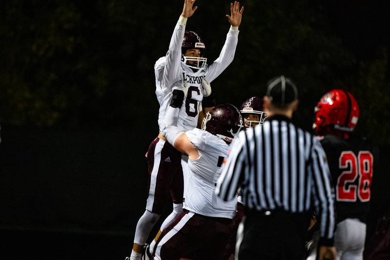 Lockport's Drew Gahhagher celebrates scoring a touchdown during a game on Friday Oct. 13, 2023 at Bolingbrook High School