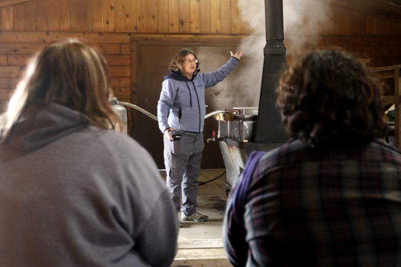 Kim Compton talks about how to make maple syrup from tree sap during the McHenry County Conservation District’s annual Festival of the Sugar Maples on Monday, March 6, 2023, at Coral Woods Conservation Area in Marengo.