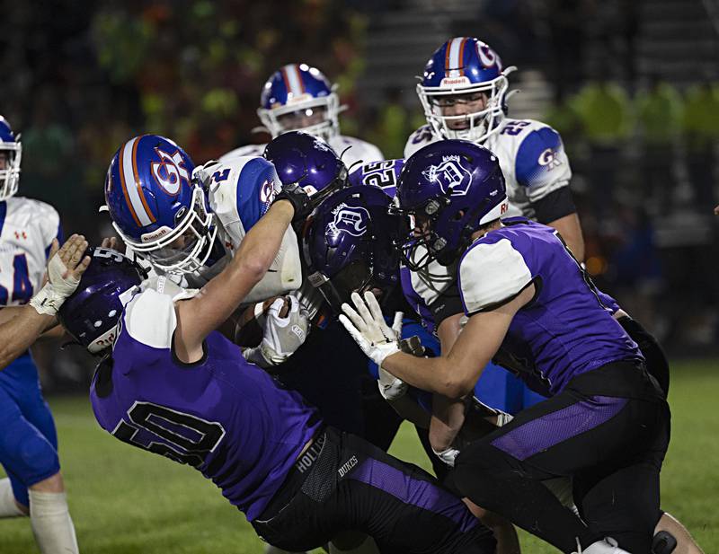 The Dixon defense pushes back G-K’s Tyler Atterberry Thursday, Sept. 14, 2023 against Genoa-Kingston in a game at Dixon High School.