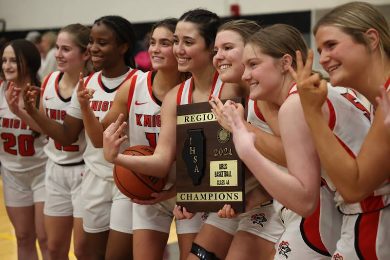 Lincoln-Way Central holds up three fingers, representing their 3rd regional title, after their 36-33 win over Stagg in the Class 4A Andrew Regional championship on Friday, Feb. 16th, 2024 in Tinley Park.