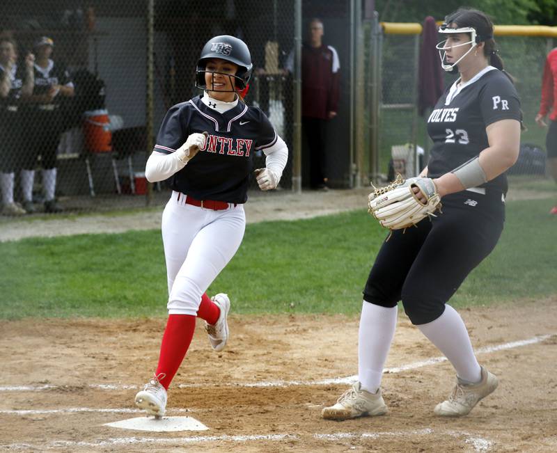 Huntley’s Ajai Bonner scores a run during a Fox Valley Conference softball game against Prairie Ridge on Monday, April 29, 2024, at Prairie Ridge High School.