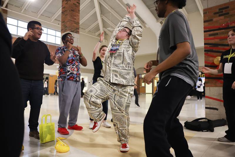 Michael Horn takes the spotlight with his dance moves at the annual Special Population Dance hosted by Joliet West high school on Friday, March 22, 2024.