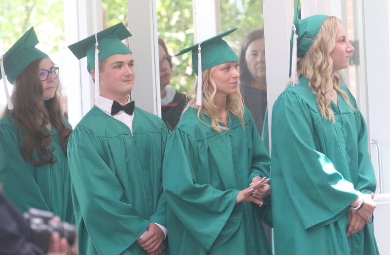 Graduates walk in procession to the Abbey Church for the commencement ceremony on Sunday, May 19, 2024 at St. Bede Academy.