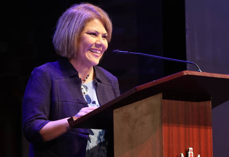 Athena Award recipient Michelle Bringas speaks after receiving her trophy Thursday, Oct. 19, 2023, during the Athena and Women of Accomplishment Awards reception hosted by the DeKalb Chamber of Commerce at the Egyptian Theatre.