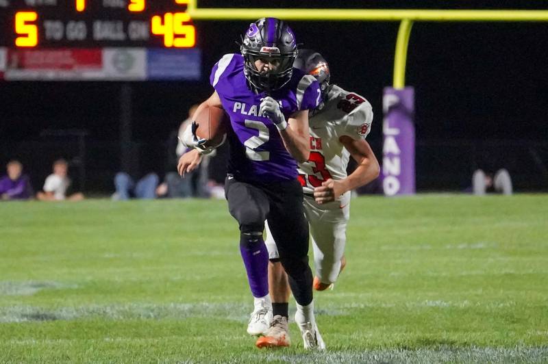 Plano’s Tristan Meszaros (2) runs after the catch against Sandwich’s Nate Hill (23) during a football game at Plano High School on Friday, Sep 13, 2024.