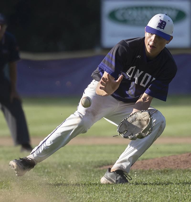 Dixon’s Quade Richards fields a bunt against Freeport Thursday, May 23, 2024 during the Class 3A regional semifinal in Dixon.