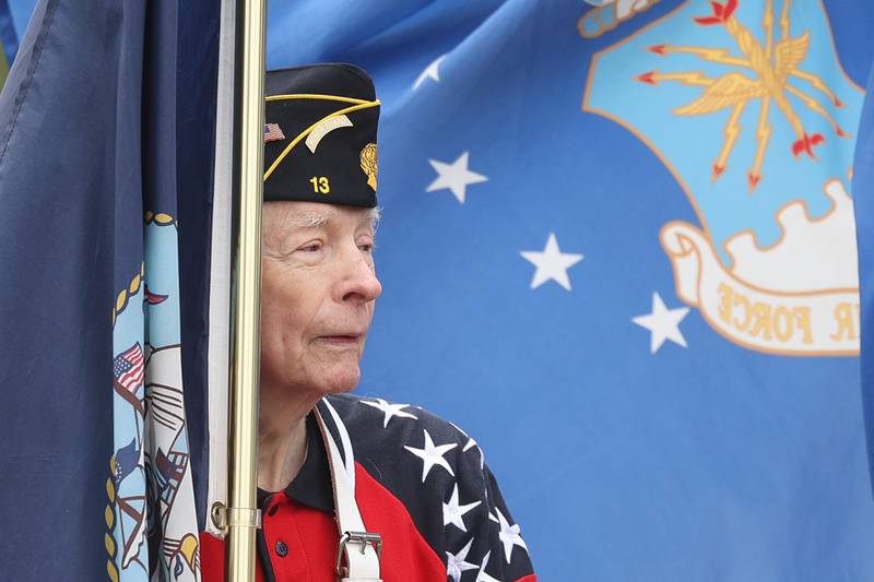 A member of the American Legion Post 13 holds a flag at Plainfield’s Memorial Day and Ceremony event on Monday, May 27, 2024.