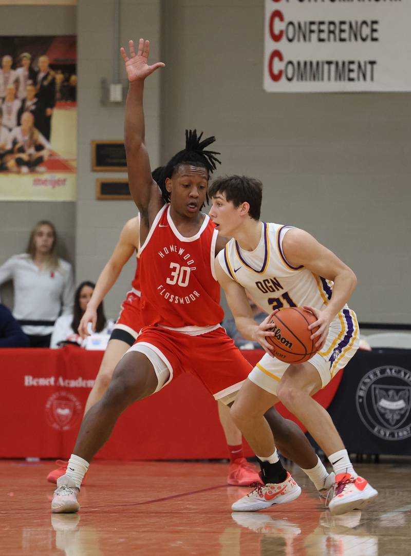 Downers Grove North’s Jack Stanton (21) is defended by Homewood-Flossmoor’s Carson Brownfield (30) during the When Sides Collide Shootout on Saturday, Jan. 20, 2024 in Lisle, IL.