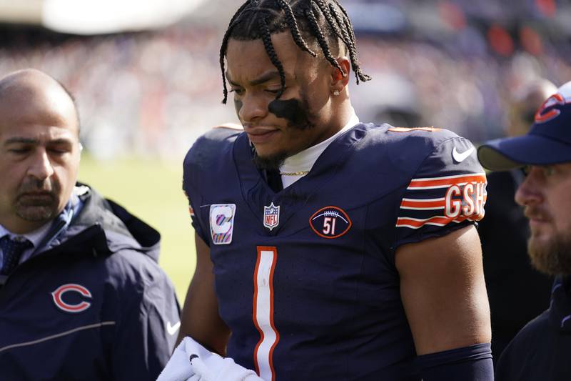 Chicago Bears quarterback Justin Fields walks to the locker room during the second half against the Minnesota Vikings on Sunday in Chicago.