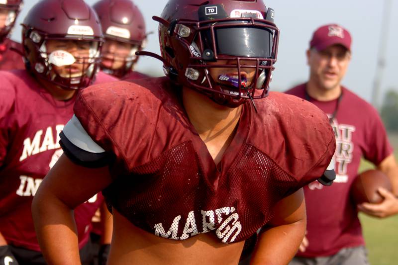 Isaac Anthony hustles to a drill during Marengo High School football practice Tuesday morning.