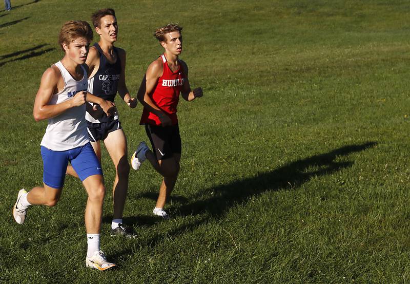 Woodstock’s Ellery Shutt, Cary-Grove’s Jameson Tenopir and Huntley’s Tommy Nitz break away from the pack as the compete in the boys race of the McHenry County Cross Country Invite on Saturday, August 31, 2024, at McHenry Township Park in Johnsburg.