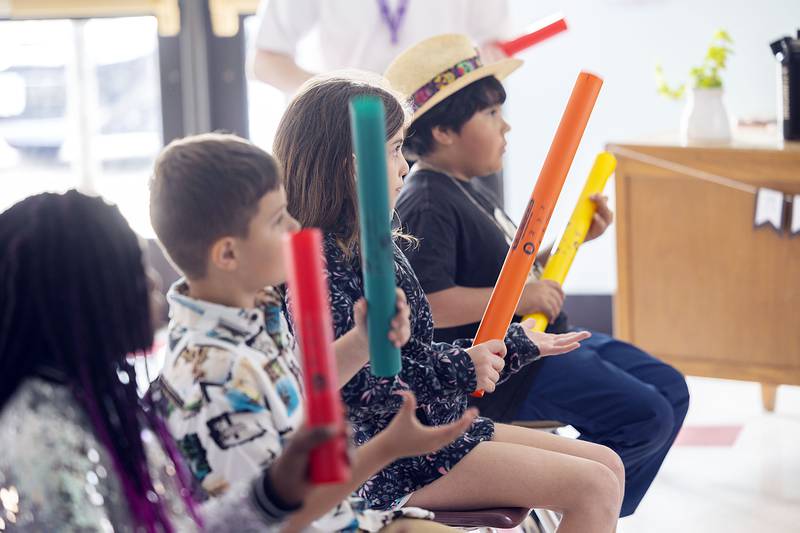 Students follow along a video that shows when each color Boomwhacker should be played.