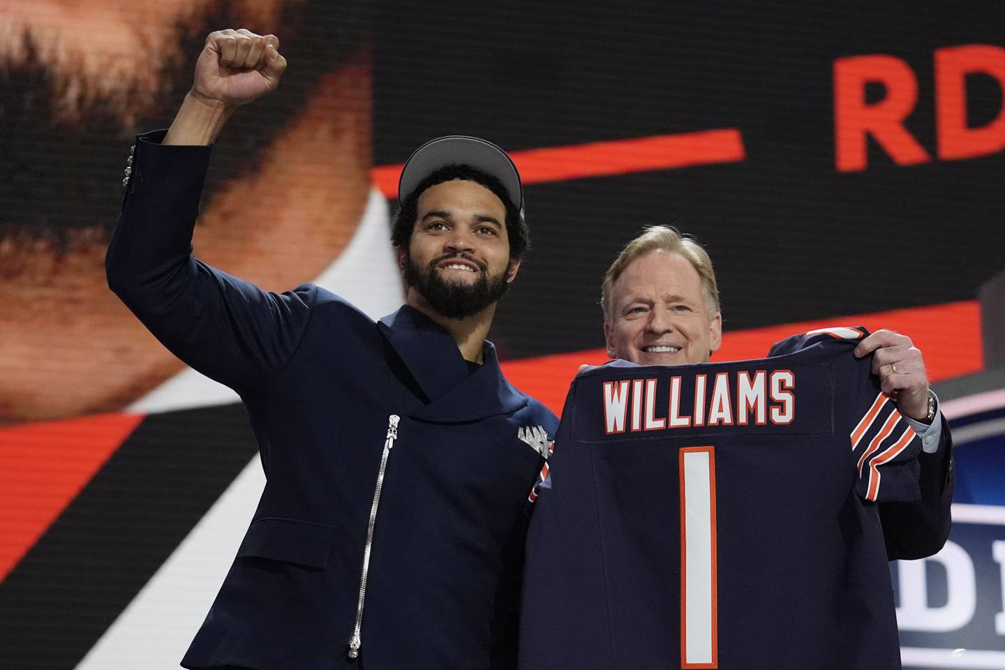 Southern California quarterback Caleb Williams celebrates with NFL commissioner Roger Goodell after being chosen by the Chicago Bears with the first overall pick during the first round of the NFL football draft, Thursday, April 25, 2024, in Detroit. (AP Photo/Jeff Roberson)