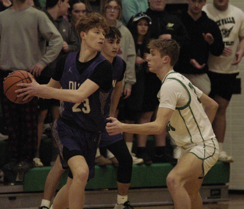 Dixon's Austin Hicks dribbles around a Rock Falls defender during their game Tuesday, Feb. 6, 2024, at Rock Falls High School.
