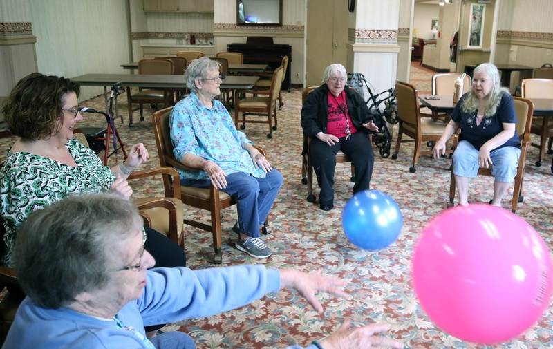 Barb City Manor residents play some catch Tuesday, July 2, 2024, at the retirement home in DeKalb. Barb City Manor celebrated its 45th anniversary earlier this year.
