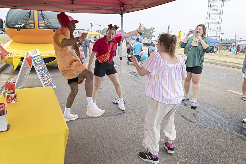 Chloe Weinie dances with her Frankmobile partner Glizzy Garrison Friday, June 30, 2023 and visitors in Rock Falls.