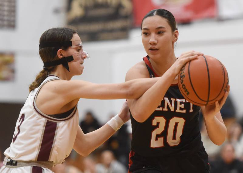 Benet Academy’s Emma Briggs, right, draws contact from Montini’s Nicolette Kerstein during the semifinal of the Montini girls basketball tournament Thursday December 28, 2023 in Lombard.