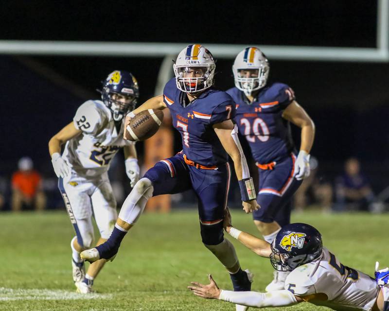 Oswego's Brett Connolly (7) runs away from the pass rush during a football game between Neuqua Valley and Oswego on Friday, Aug. 30, 2024 in Oswego. Gary E Duncan Sr for Shaw Local News Network.