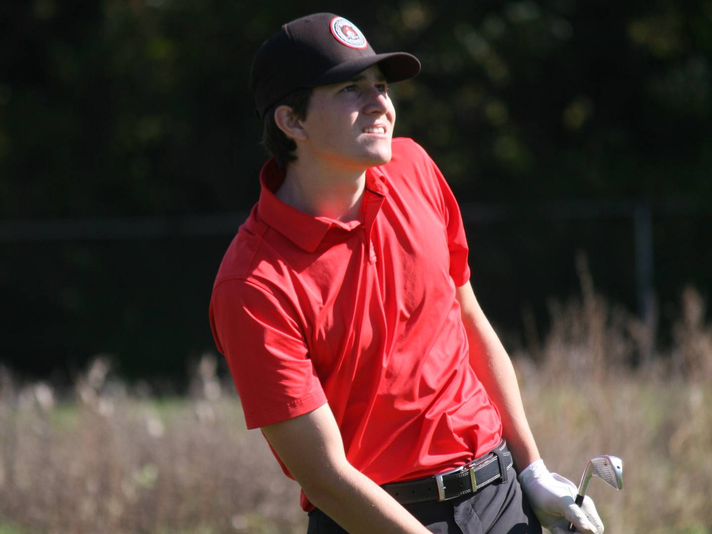 Ottawa's Chandler Creedon uses body English as he tees off the seventh hole at Weibring Golf Course on Saturday.