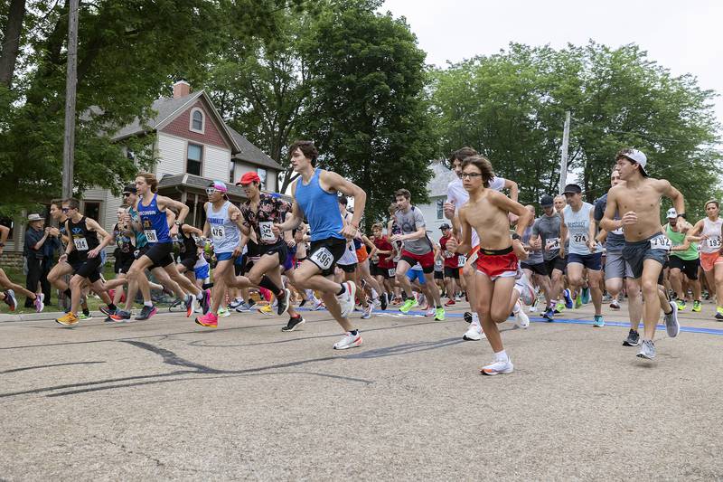 Runners fire out of the gate Saturday, July 1, 2023 at the start of the 23rd annual Reagan Run in Dixon. The 5K starts at the Reagan Boyhood home and ends at Haymarket Square.