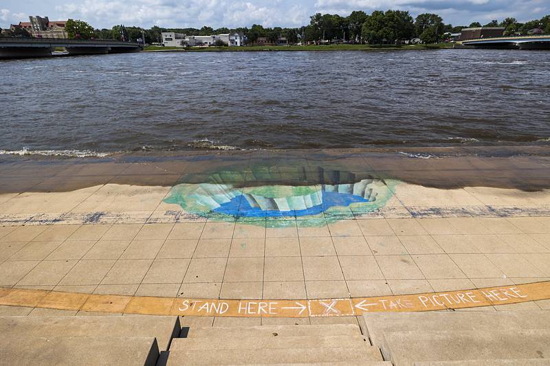 Water laps up into Heritage Plaza Monday, July 15, 2024 in Dixon. Water levels continue to raise all through the Rock River Valley.