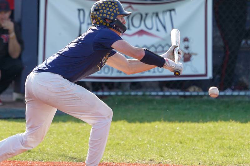 Neuqua Valley's Matt Knapczyk (9) bunts the ball for a single against Yorkville during a Class 4A Neuqua Valley Regional semifinal baseball game at Neuqua Valley High School in Naperville on Thursday, May 23, 2024.