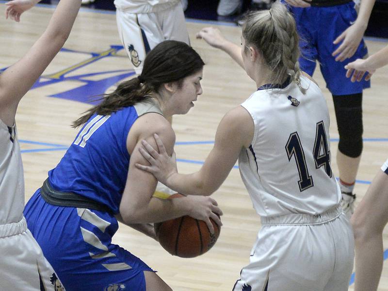 Princeton’s Olivia Gartin works to get past Marquette’s Eva McCallum for a layup during the 2nd period in Bader Gymnasium on Saturday, Jan. 7, 2023 at Marquette High School.