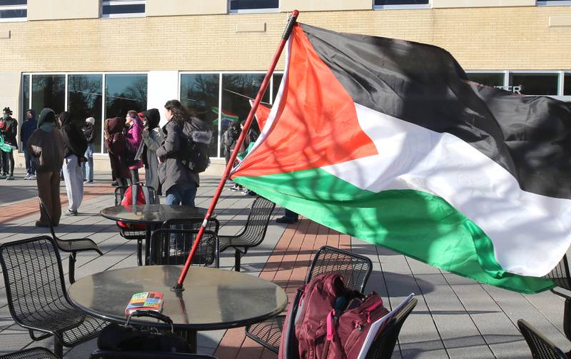A Palestinian flag flaps in the wind during a protest against the Israel–Hamas war Thursday, Feb. 29, 2024, outside the Holmes Student Center at Northern Illinois University in DeKalb.