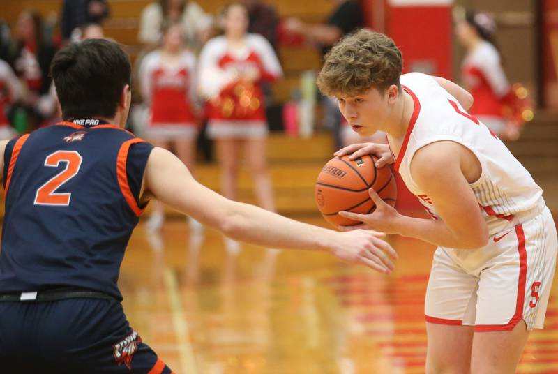 Streator's Isaiah Weibel looks to pass the ball around Pontiac's Camden Fenton during the Class 3A Regional semifinal game on Wednesday, Feb. 22, 2024 at Pops Dale Gymnasium.