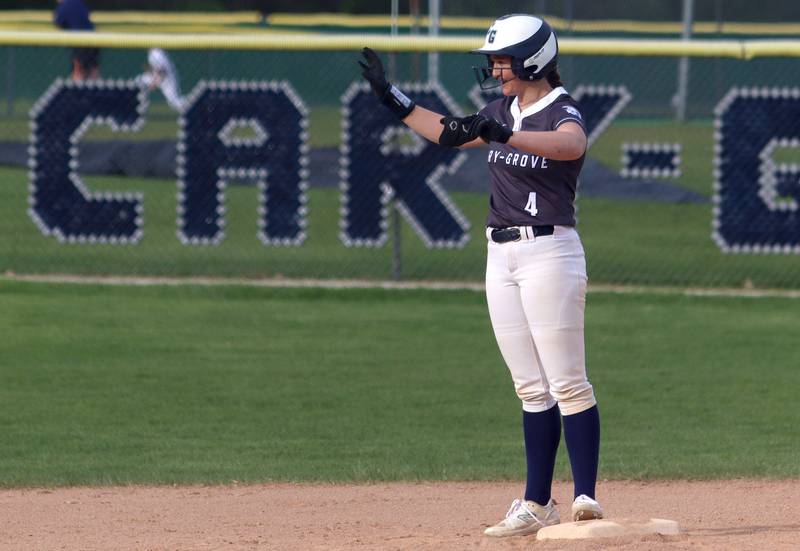 Cary-Grove’s Maddie Crick reacts after stroking a double against Burlington Central in varsity softball at Cary Monday.