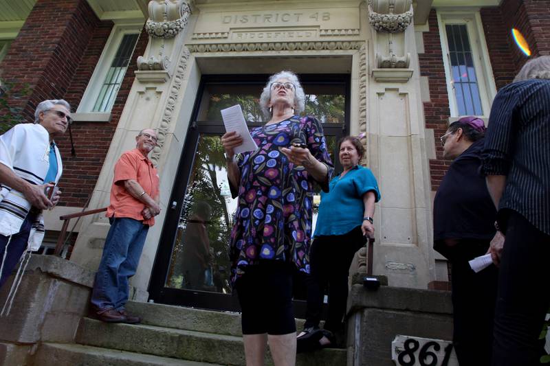 Rabbi Maralee Gordon speaks as the McHenry County Jewish Congregation held a deconsecration ceremony at their Ridgefield Road location in preparation for a move to the Tree of Life Unitarian Church in McHenry on Sunday, August 18. Mezuzot were removed from doorways and the Torah Scrolls were removed from their ark and transported  to the new building as worshipers consecrated the new building as their synagogue.