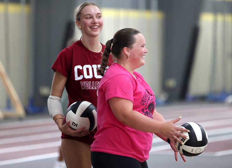 Ava Carpenter (left) and Julia Weaver have a laugh during a drill at Sycamore High School volleyball camp Tuesday, July 23, 2024, at Sycamore High School.