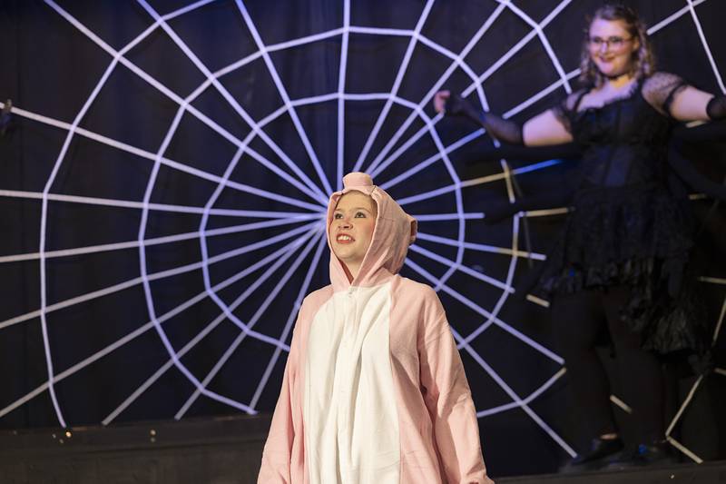 Bailey Kibodeaux, playing the part of Wilbur the pig in Charlotte’s Web rehearses a scene Tuesday, Feb. 20, 2024 in Polo. In this scene Wilbur’s meets his new friend Charlotte the spider.