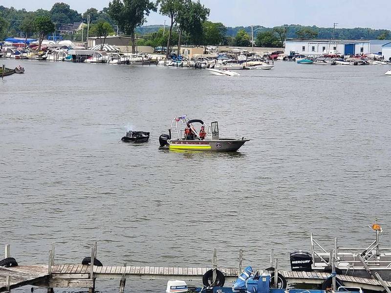 A Fox Lake Fire Protection District boat towed the charred wreckage of a small vessel back to shore the afternoon of Sunday, Aug. 6, 2023.