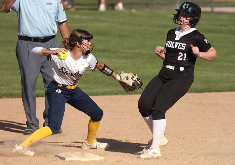 Sterling's Kaity Taylor tries to turn a double play after forcing out Prairie Ridge's Mary-Kate Center during their Class 3A sectional semifinal game Wednesday, May 29, 2024, at Sycamore High School.