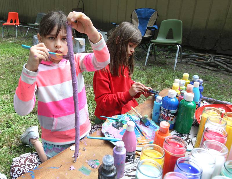 Scarlett Rodriguez, 6, of Round Lake and her sister, Leah, 8, paint talking sticks during the 30th Annual Potawatami Trails Pow-Wow at Shiloh Park on Saturday, August 26th in Zion. 
Photo by Candace H. Johnson for Shaw Local News Network