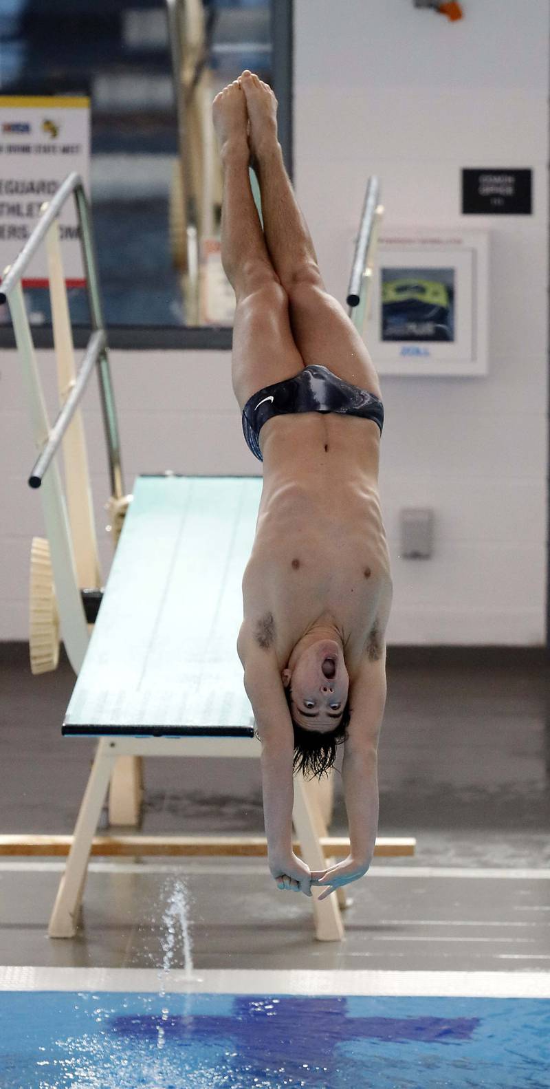 Cooper Kosanovich of Nazareth Academy competes in the Boys 1 mtr Diving during the IHSA Boys state swim finals Saturday February 25, 2023 in Westmont.