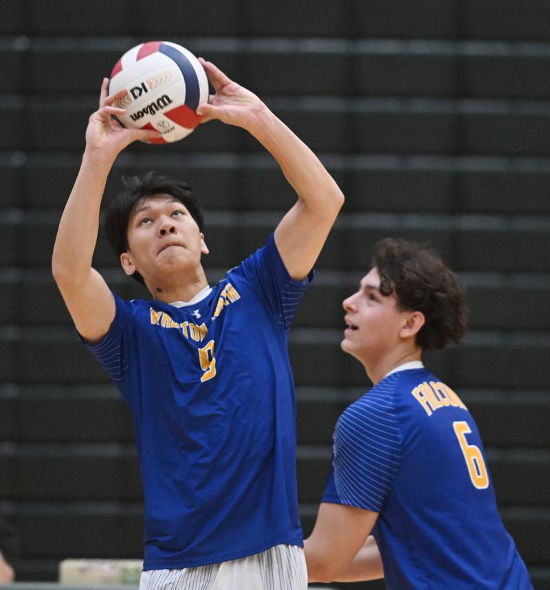 Wheaton North’s Htat Naing sets the ball as teammate Tomas Manrique moves toward the net during a semifinal match of the Fremd boys volleyball tournament on Saturday, May 4, 2024 in Palatine.