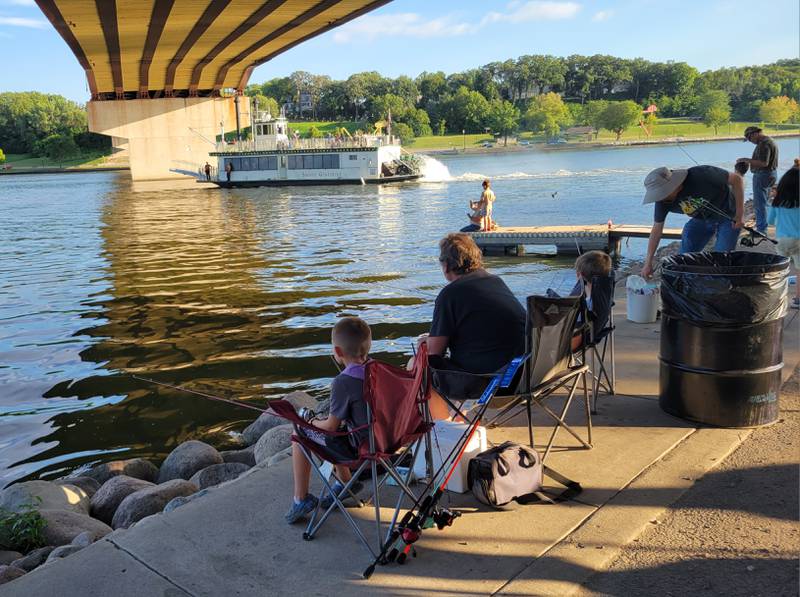 The Saint Genevieve riverboats passes some of the participants during the 2023 Ottawa Kids Fishing Rodeo.