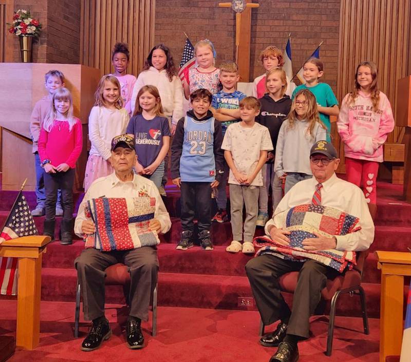 Cross Lutheran School third graders presented Quilts of Honor that they helped create to two local veterans.