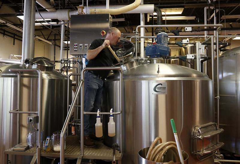 Brewmaster Ryan Clooney brews a batch of beer on Friday, May 3, 2024 at the Crystal Lake Brewing. The brewery is celebrating its 10th anniversary and recently won a bronze award in Brown Porter category at the World Beer Cup in Las Vegas.