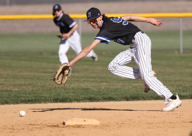 Newark's Kiptyn Bleuer reaches for a ball up the middle Monday, April 8, 2024, during their game at Hinckley-Big Rock High School.