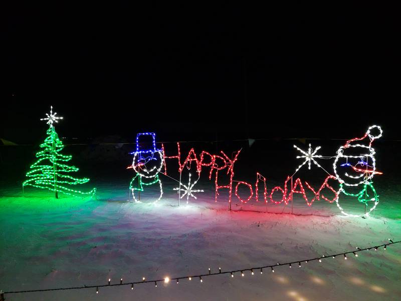 A lighted display wishes Happy Holidays at the Home for the Holidays Light Show at Bureau County Fairgrounds in Princeton.