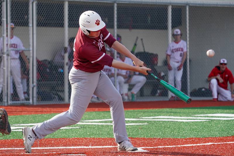 Plainfield North's Kyle Darlington (14) hits an RBI single against Yorkville during a baseball game at Yorkville High School in Yorkville on Thursday, May 16, 2024.