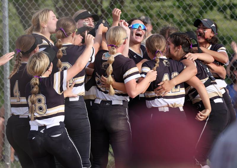 Sycamore players celebrate after winning the Class 3A sectional final over Prairie Ridge Friday, May 31, 2024, at Sycamore High School.