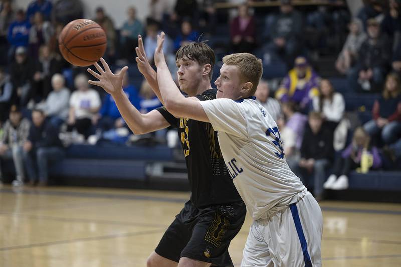 Newman’s Dax Snyder and AFC’s Brock Lehman work below the basket Monday, Feb. 19, 2024 in a regional quarterfinal game at Newman High School.