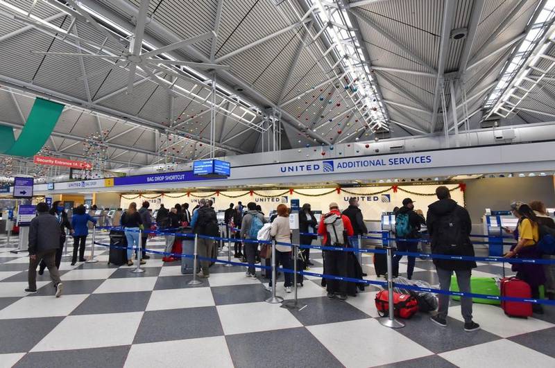 Passengers check in for departing flights at O'Hare International Airport's Terminal 1 in this undated Daily Herald file photo. About 2.9 million passengers are expected over the holidays at O'Hare and Midway International Airport.