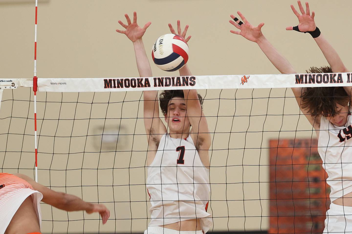 Lincoln-Way West’s Colin Dargan gets the block against Minooka on Monday, April 8, 2024.